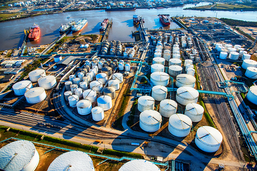 Oil storage tanks at industrial port terminal facility