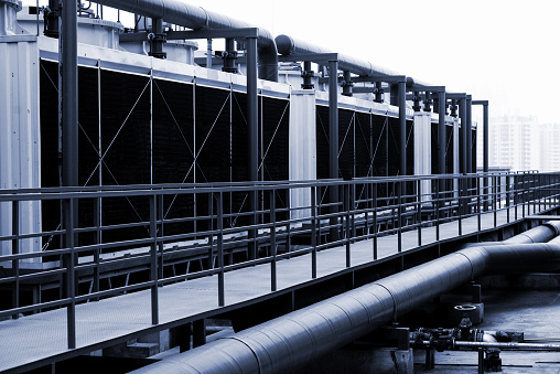 Industrial cooling towers with piping system