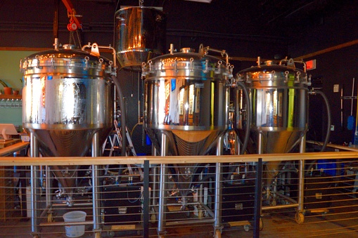 Stainless steel brewing tanks in facility
