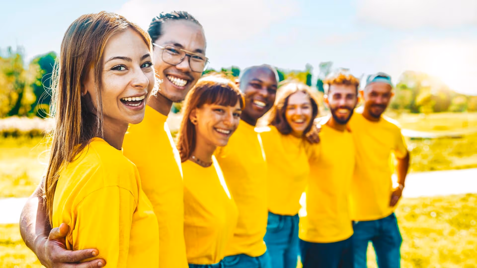 Team of people wearing yellow t-shirts