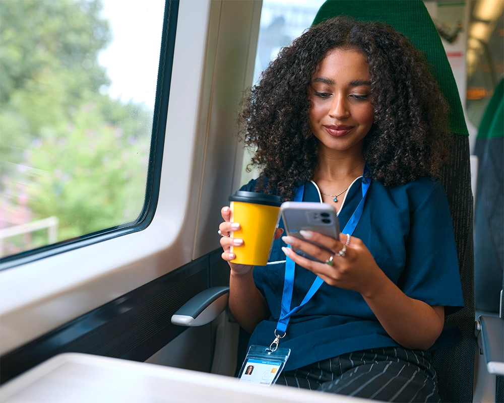 Lady using a phone on the train