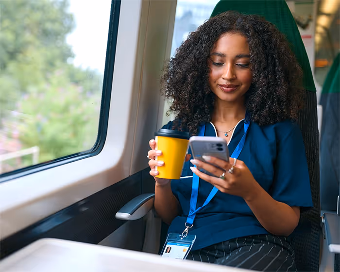 Lady using a phone on the train