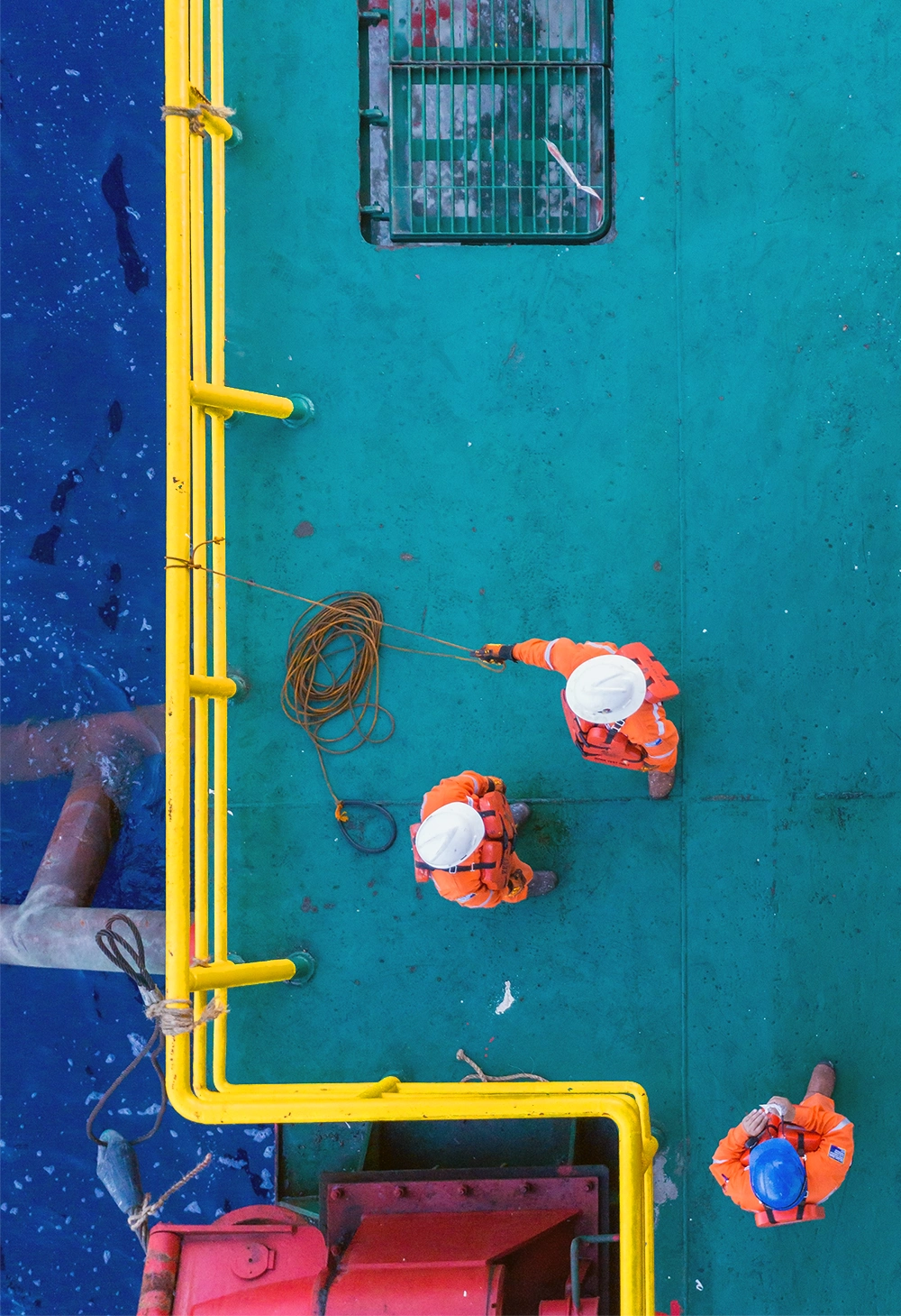 2 people working on a ship