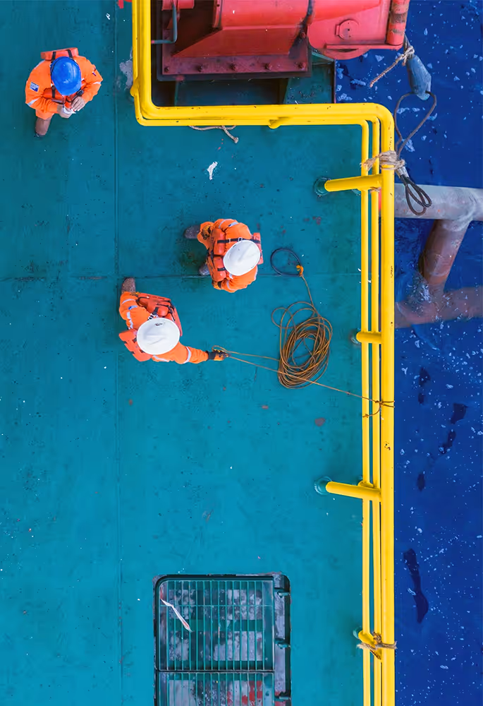2 people working on a ship