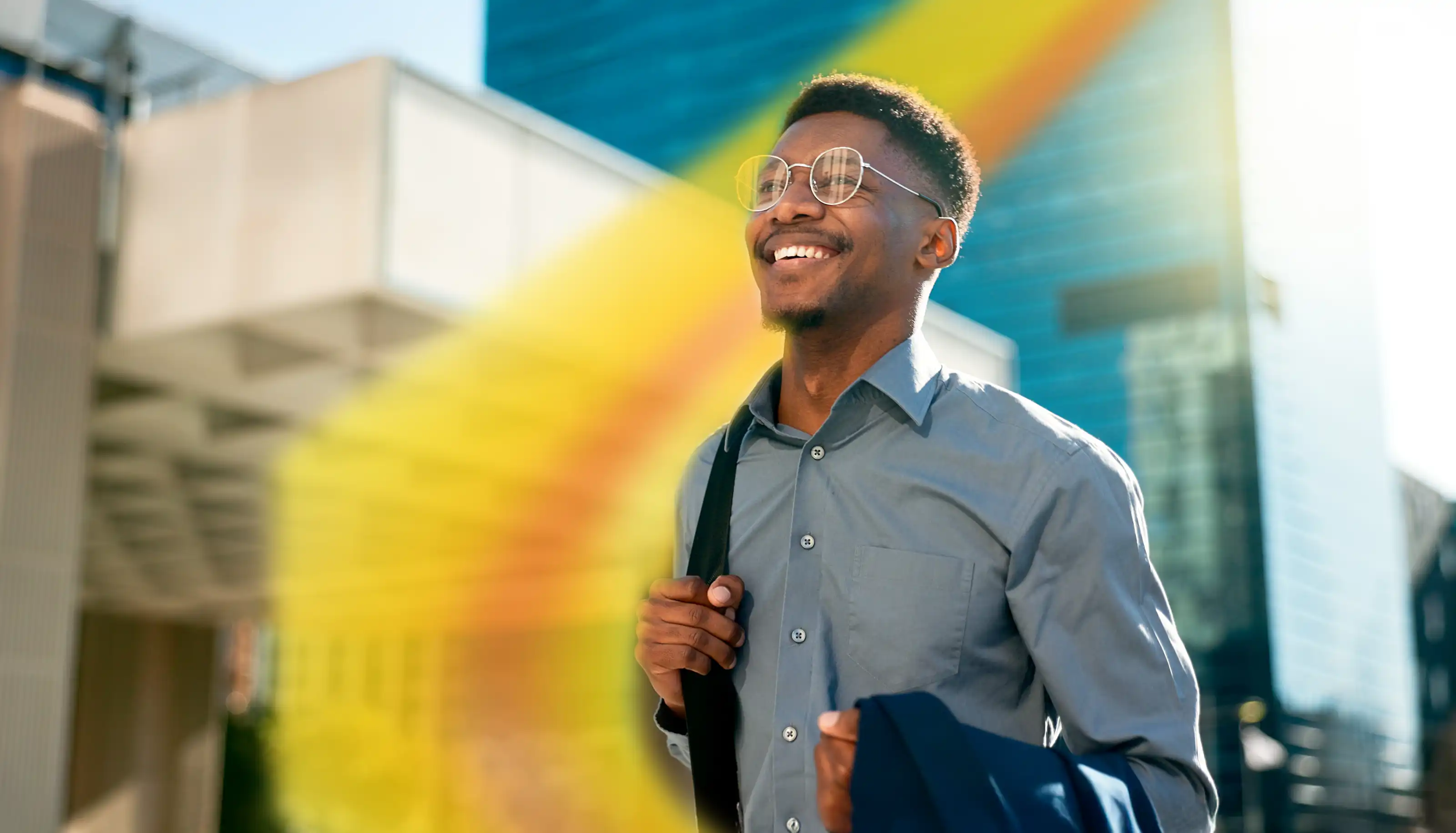a man in a suit stood in a city
