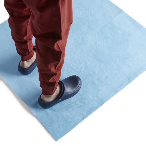 Theatre nurse standing on absorbent mat