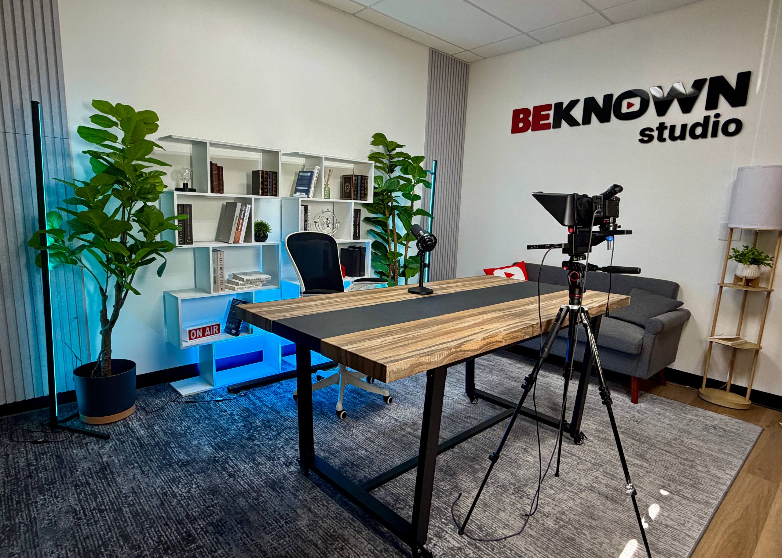Customizable white shelves in the White Podcast Room at BeKnown Studio Scottsdale