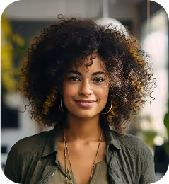 a woman with curly hair smiling