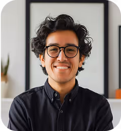 a man wearing glasses smiling