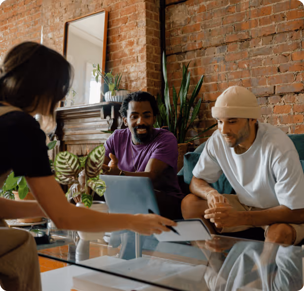 a group of people sitting around a table
