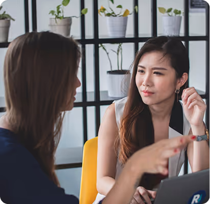 a woman talking to another woman