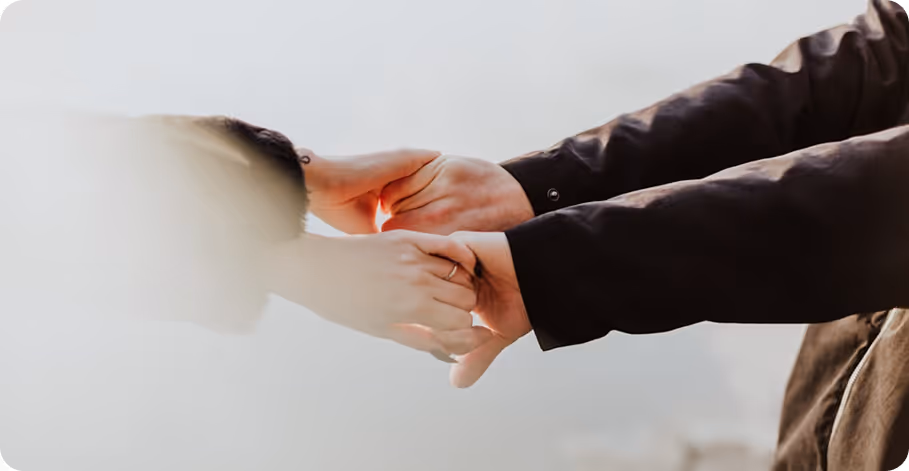 a close up of a couple hands
