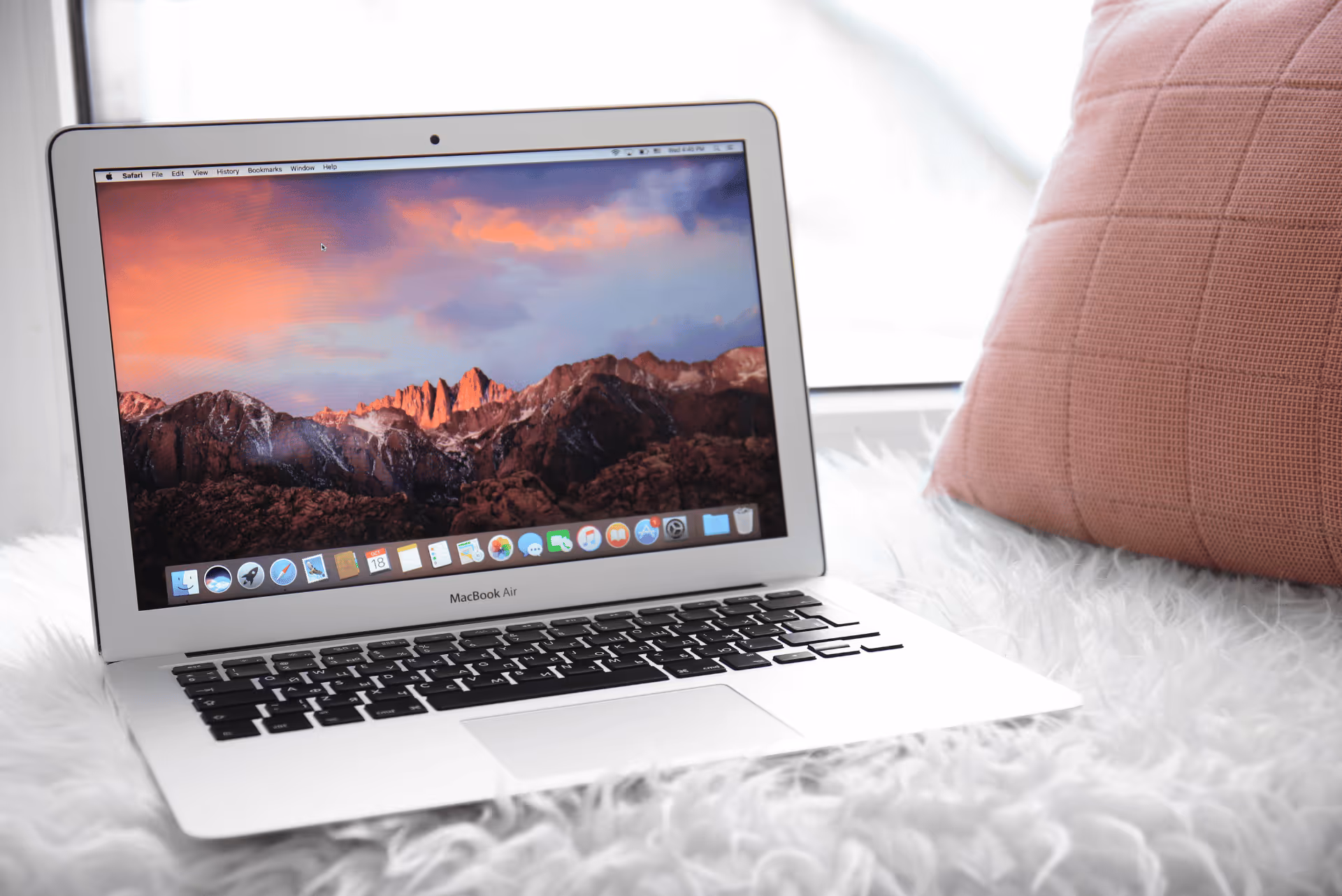 open laptop with a corporate screensaver on