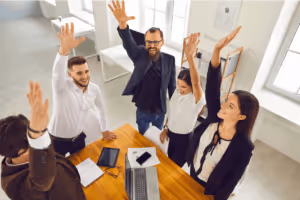 office workers raising their hands