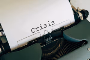 typewriter with the word crisis