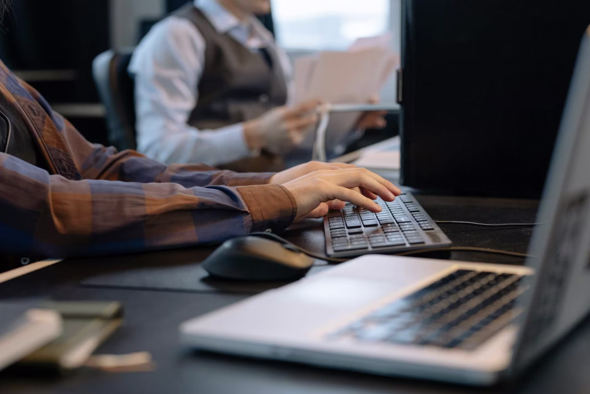 typing at a computer keyboard sending an internal communication message
