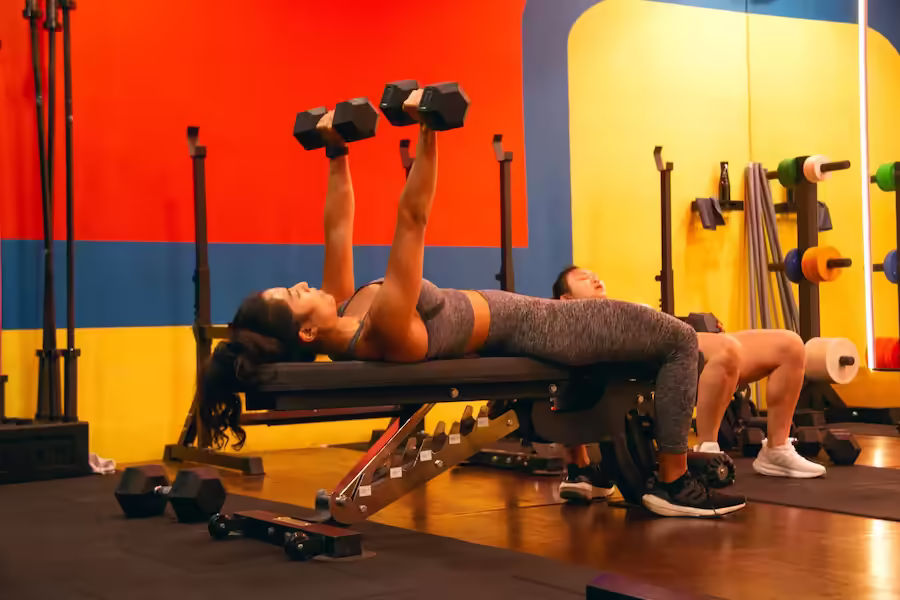 group class clients motivating each other through a challenging set