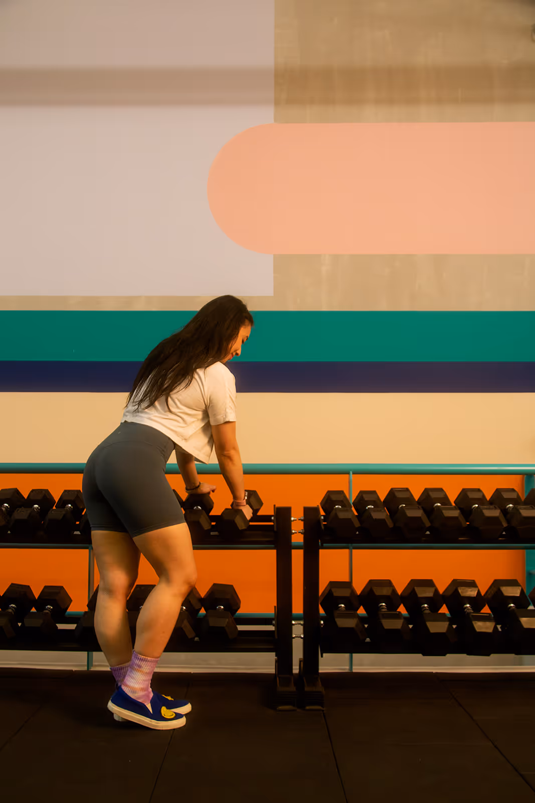 Interior of the gym showcasing weights, racks, and training zones