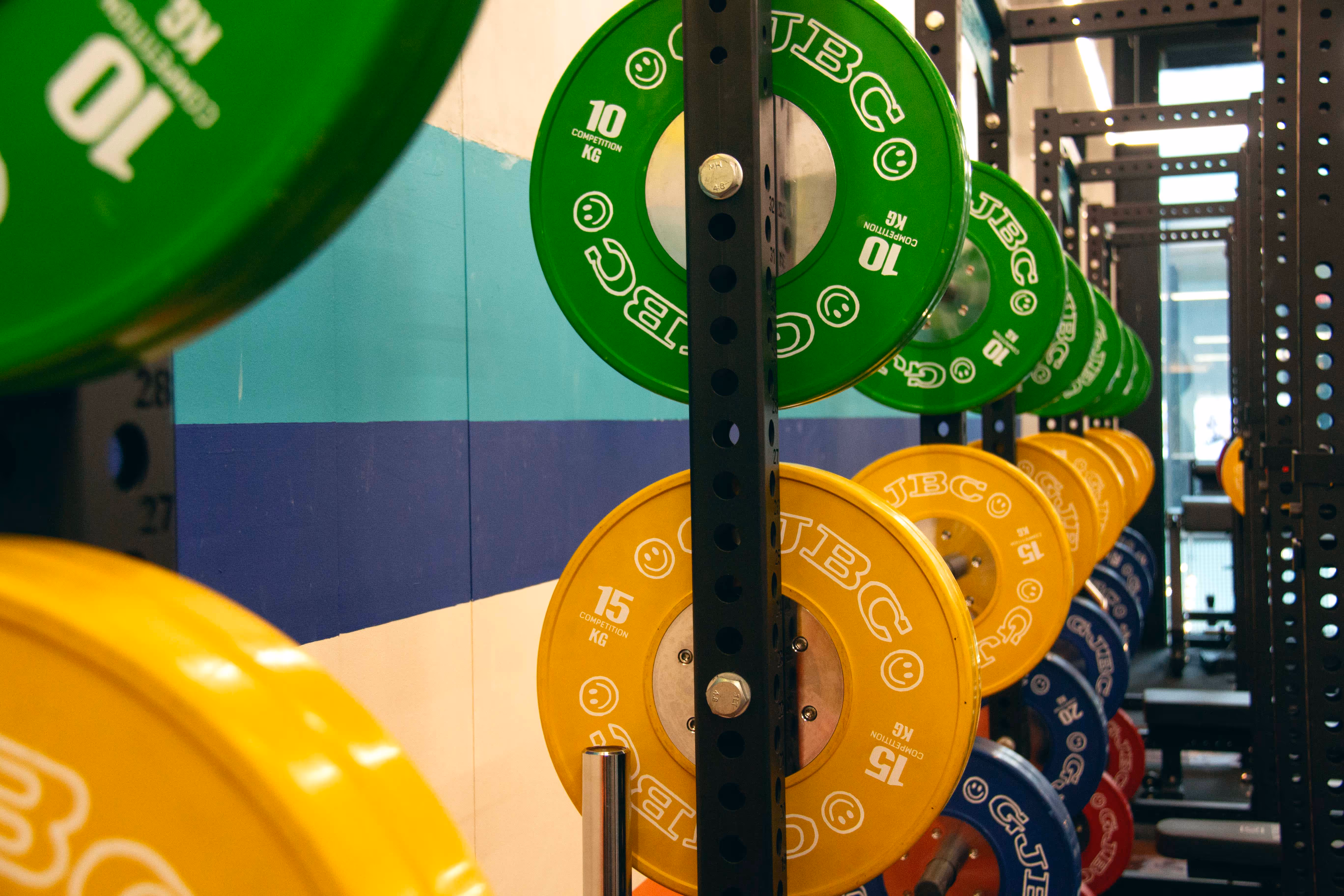 Interior of the gym showcasing weights, racks, and training zones