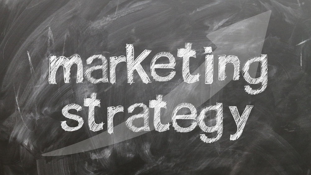 Marketing strategy written on black chalkboard