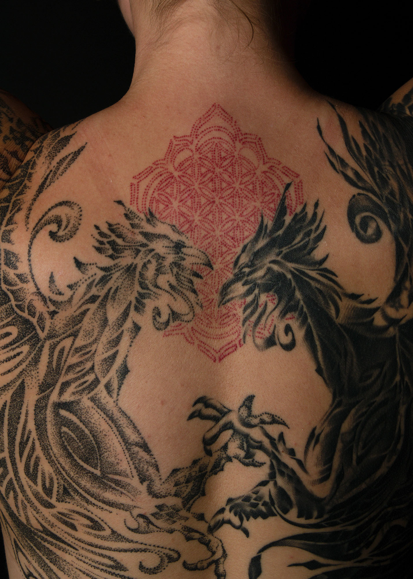 Dynamic black ink tattoo illustrating a graceful and fluid tribal pattern, embodying cultural significance and modern artistic expression