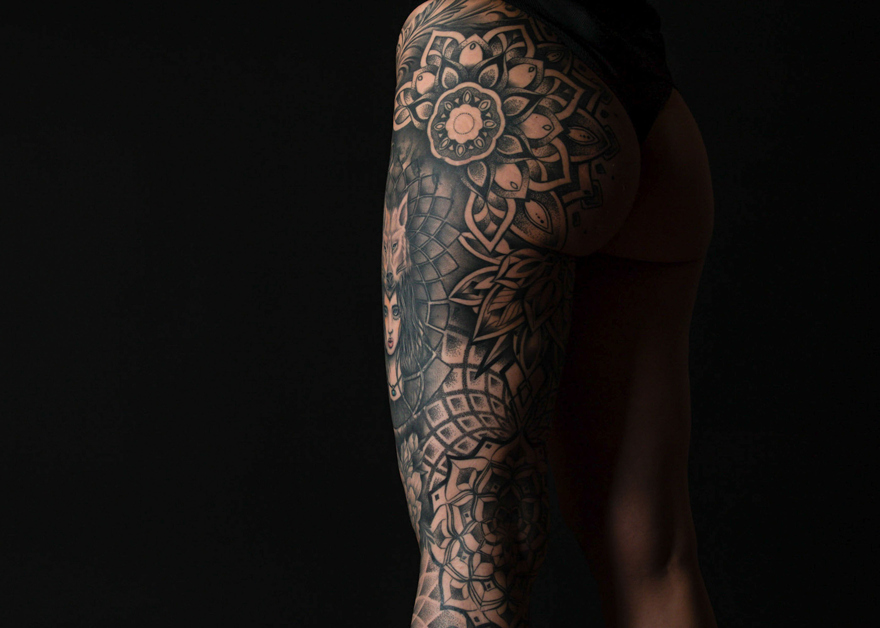 Dynamic black ink tattoo illustrating a graceful and fluid tribal pattern, embodying cultural significance and modern artistic expression