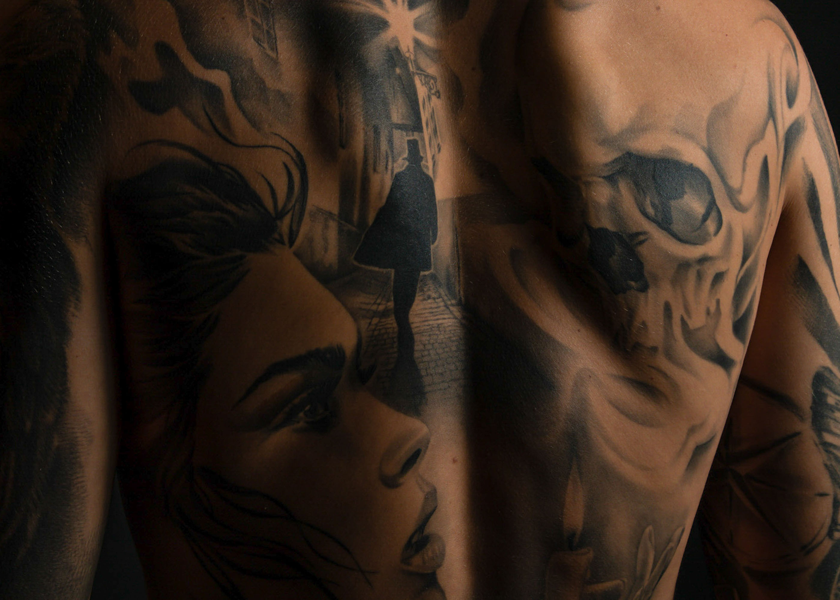 Intriguing black tattoo portraying a celestial scene of a crescent moon surrounded by stars, blending cosmic beauty with artistic finesse