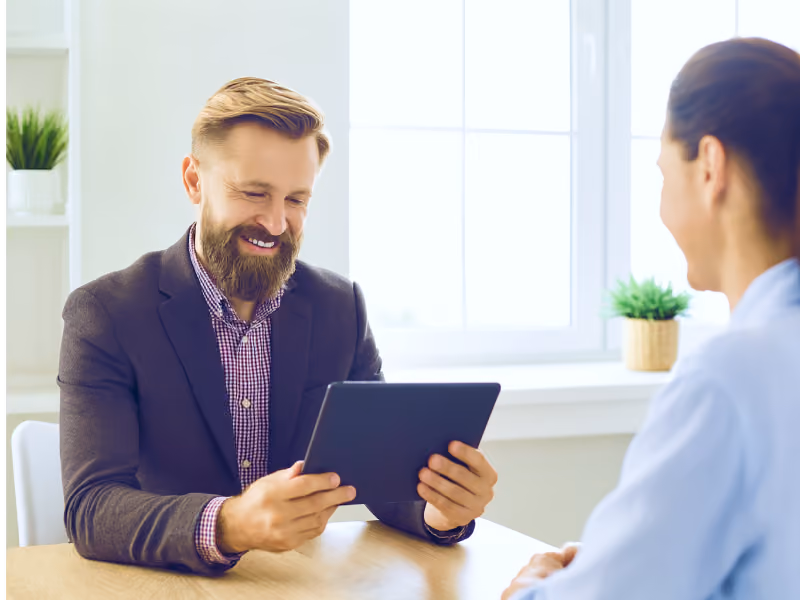 Bank employee using secure, pre-enrolled tablet with Bento MDM.