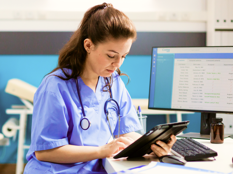 Image showing a doctor using a tablet running Bento MDM software