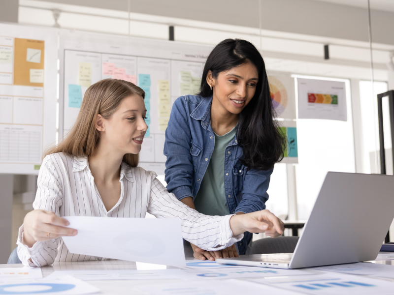 Image showing two people consulting over a laptop running Bento MDM