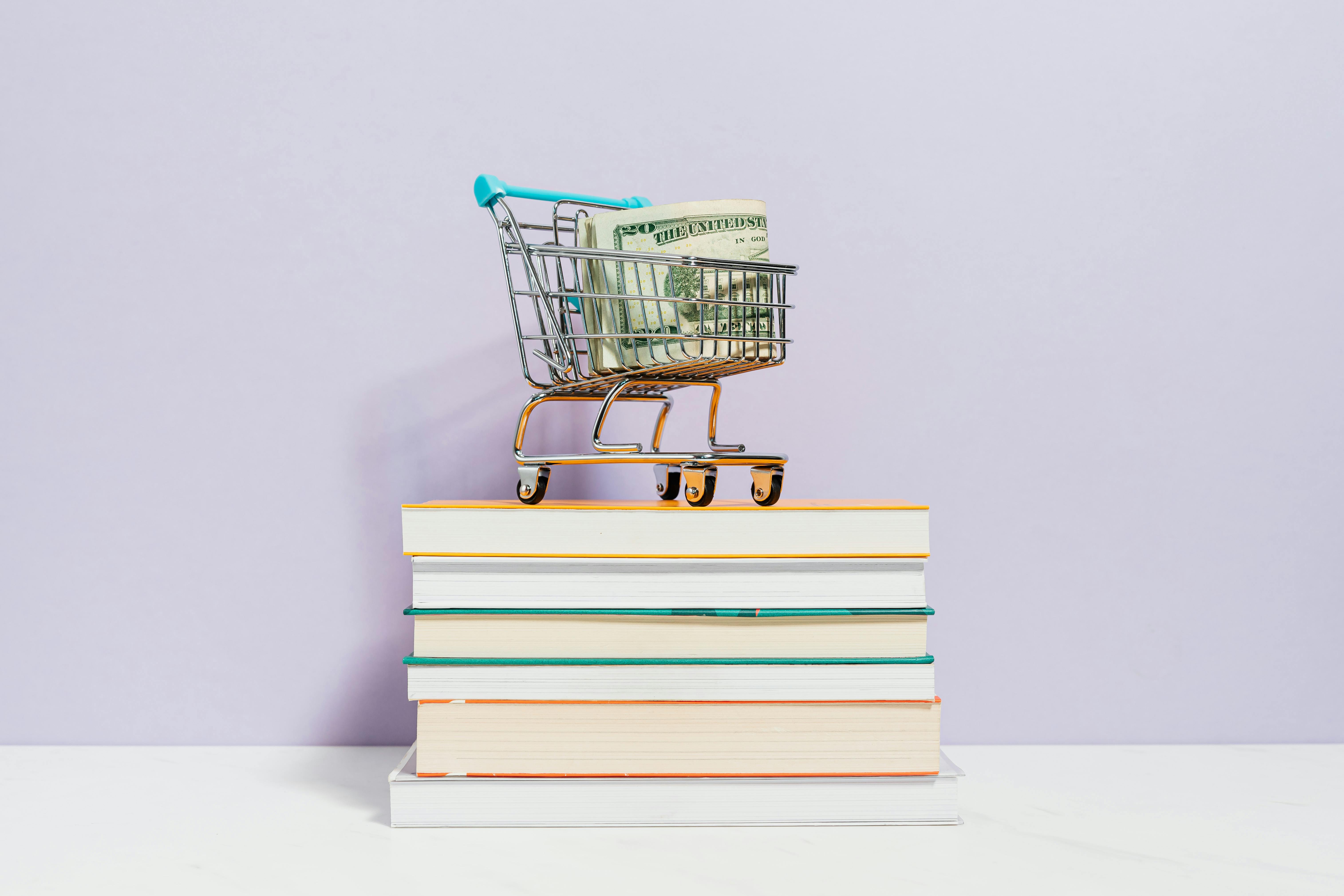 A Shopping Cart on Top of Books