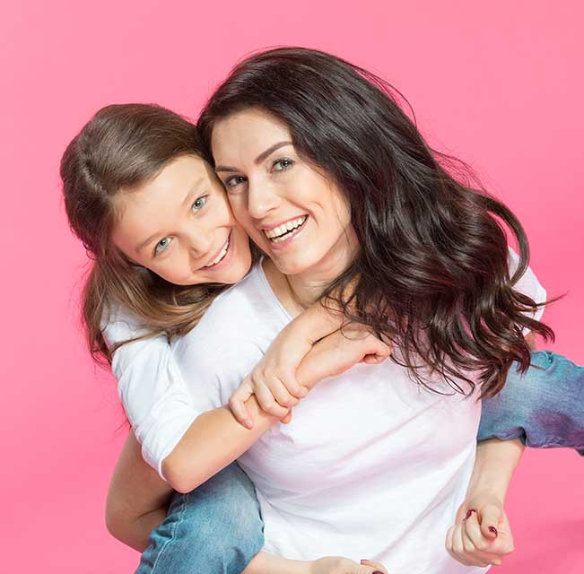 Smiling mother and daughter