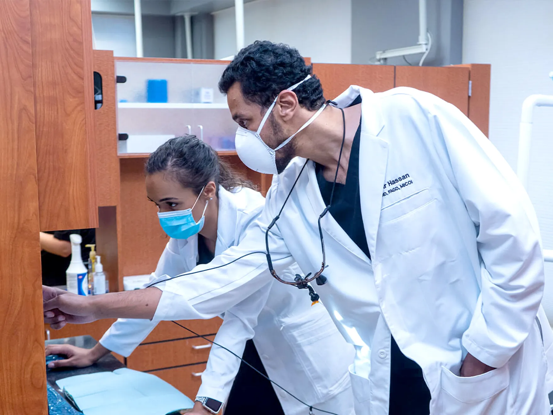 Apex Dental Team Members looking at the computer