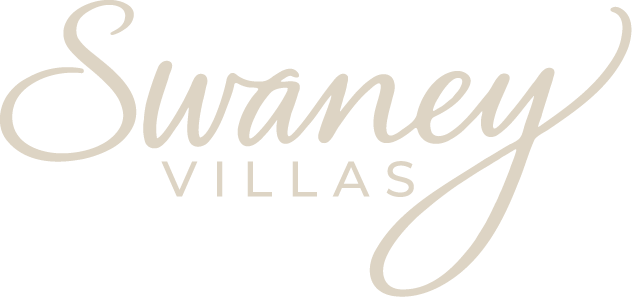 Swaney Villas logo in elegant beige script and uppercase letters on a transparent background.