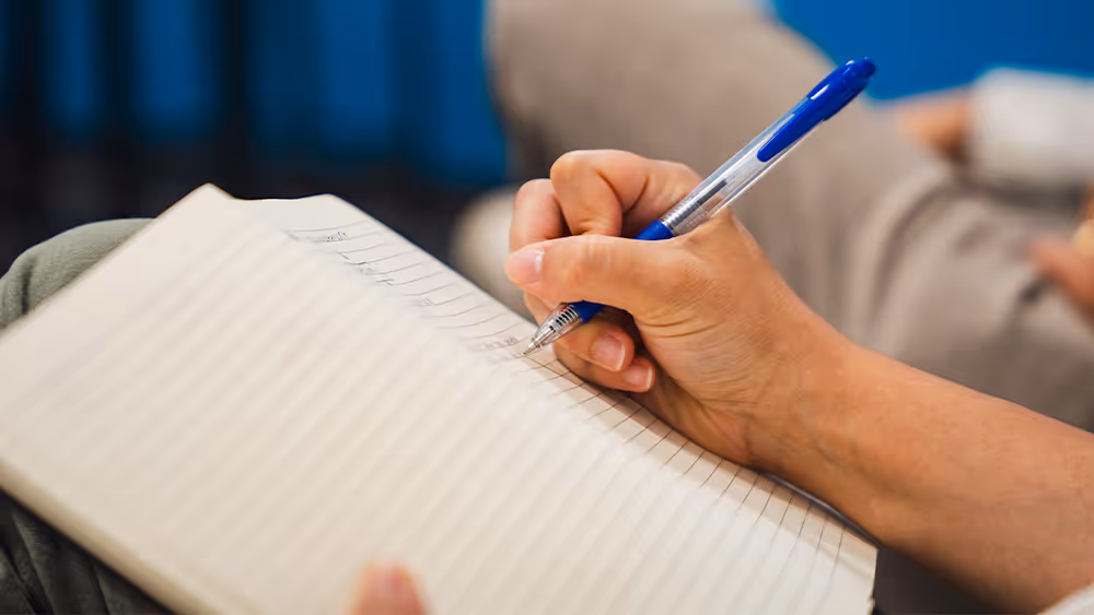 Close up of someone taking notes