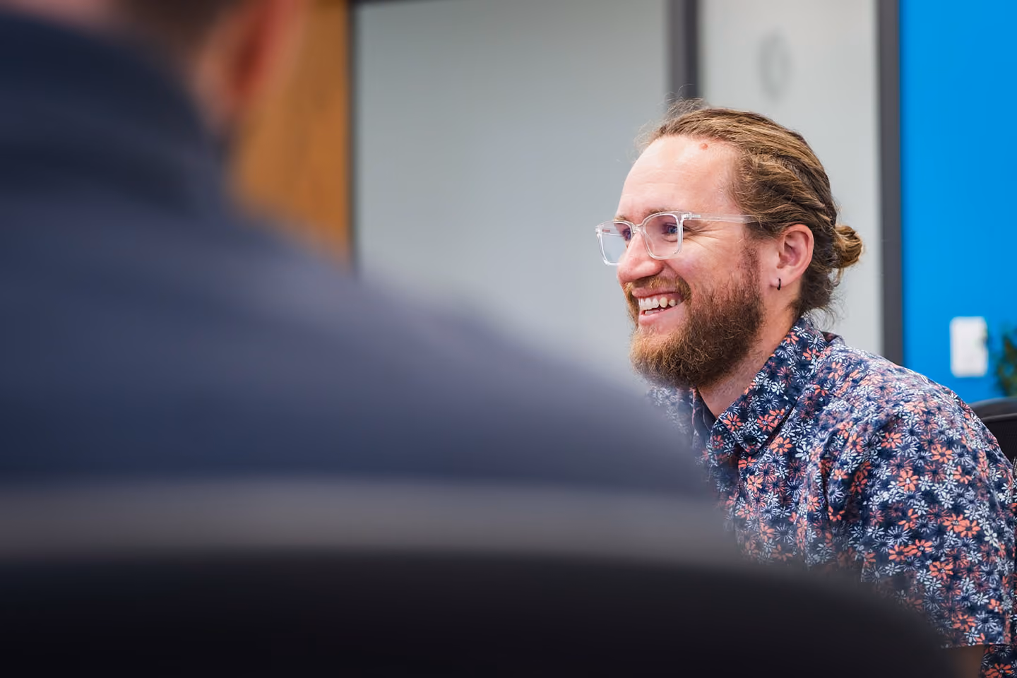 Team member smiling in a meeting