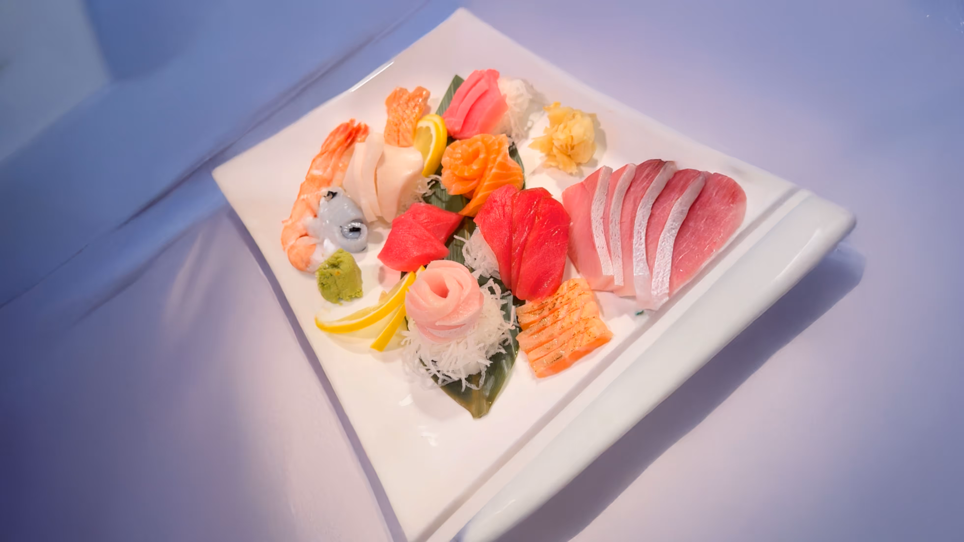 A plate of assorted sushi featuring various types of fish.