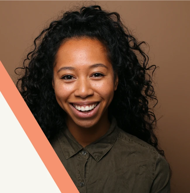 A smiling young woman, who is confident with her oral health because she is a client at Smill Heights