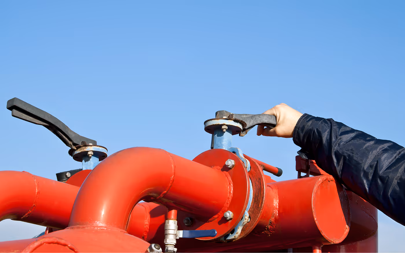 person working on a pump system