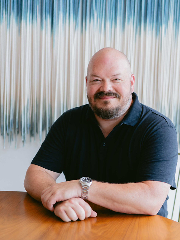 Ben Dickinson, founder of Doug Fir Operations, known for earning trust and buy-in from manufacturing teams during high-stakes transitions