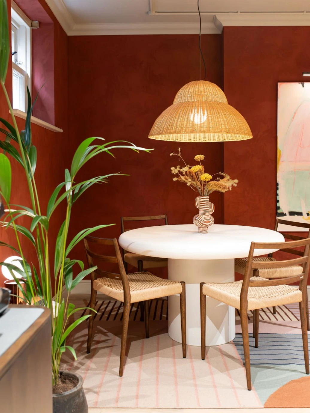 Boutique design studio nook with warm wall tones and statement pendant lighting