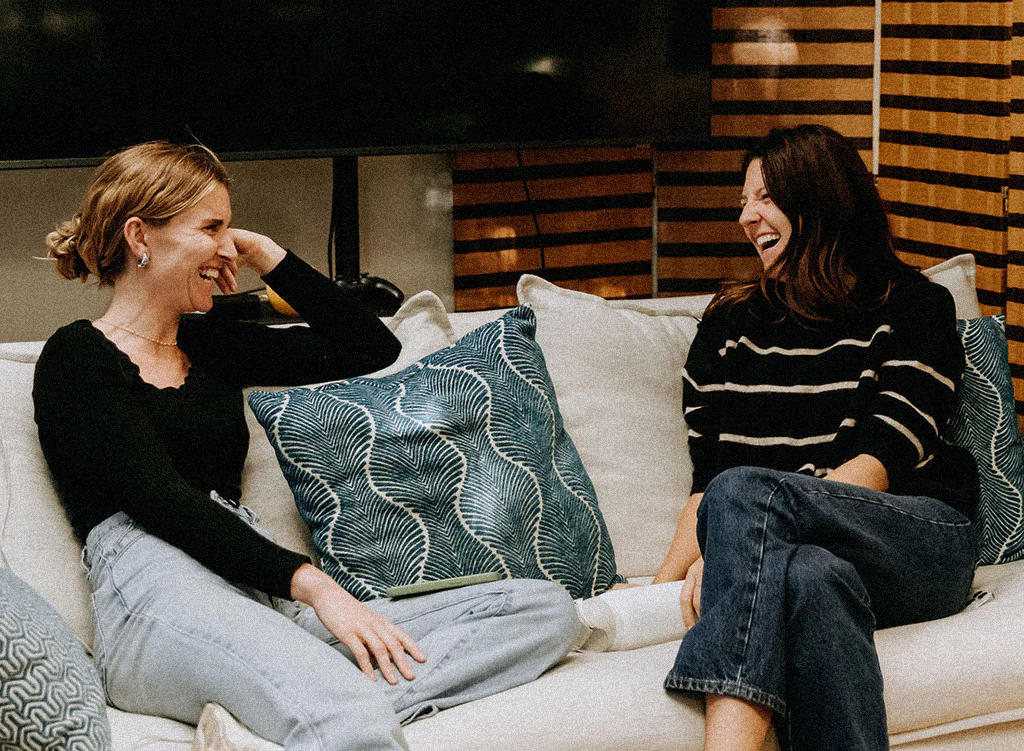 Two Runway employees chatting at the SF office