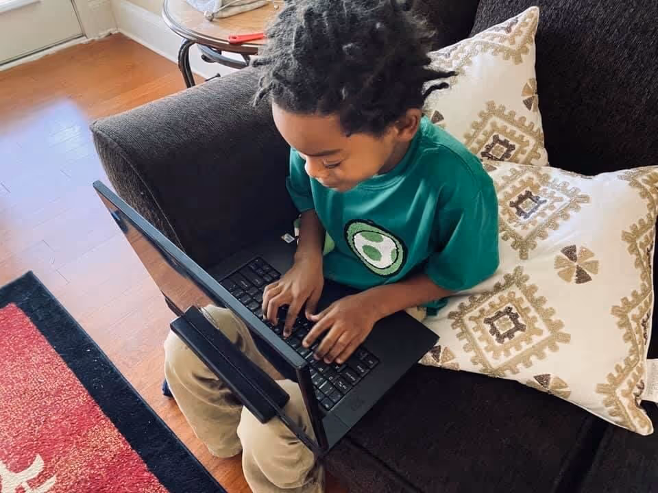 A boy on a laptop