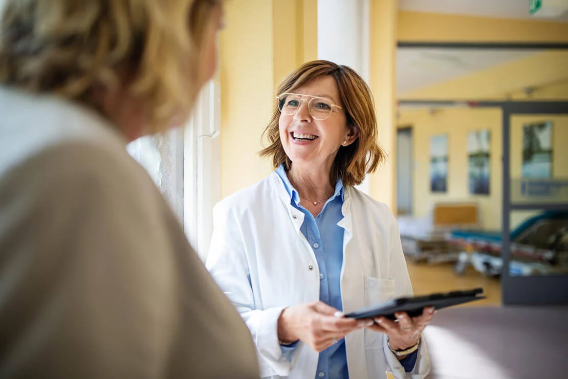 A doctor is smiling