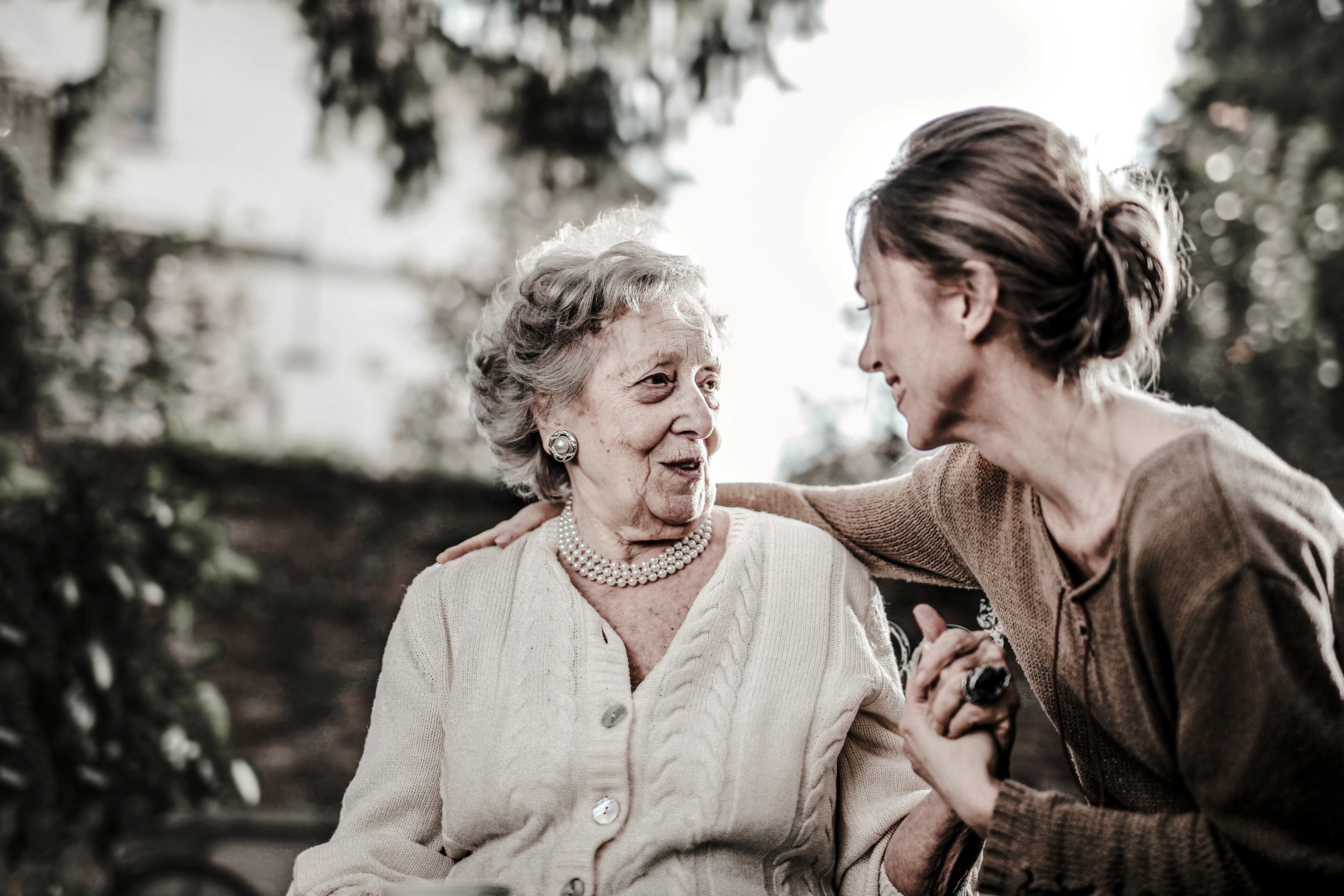 A young lady and an old lady are talking