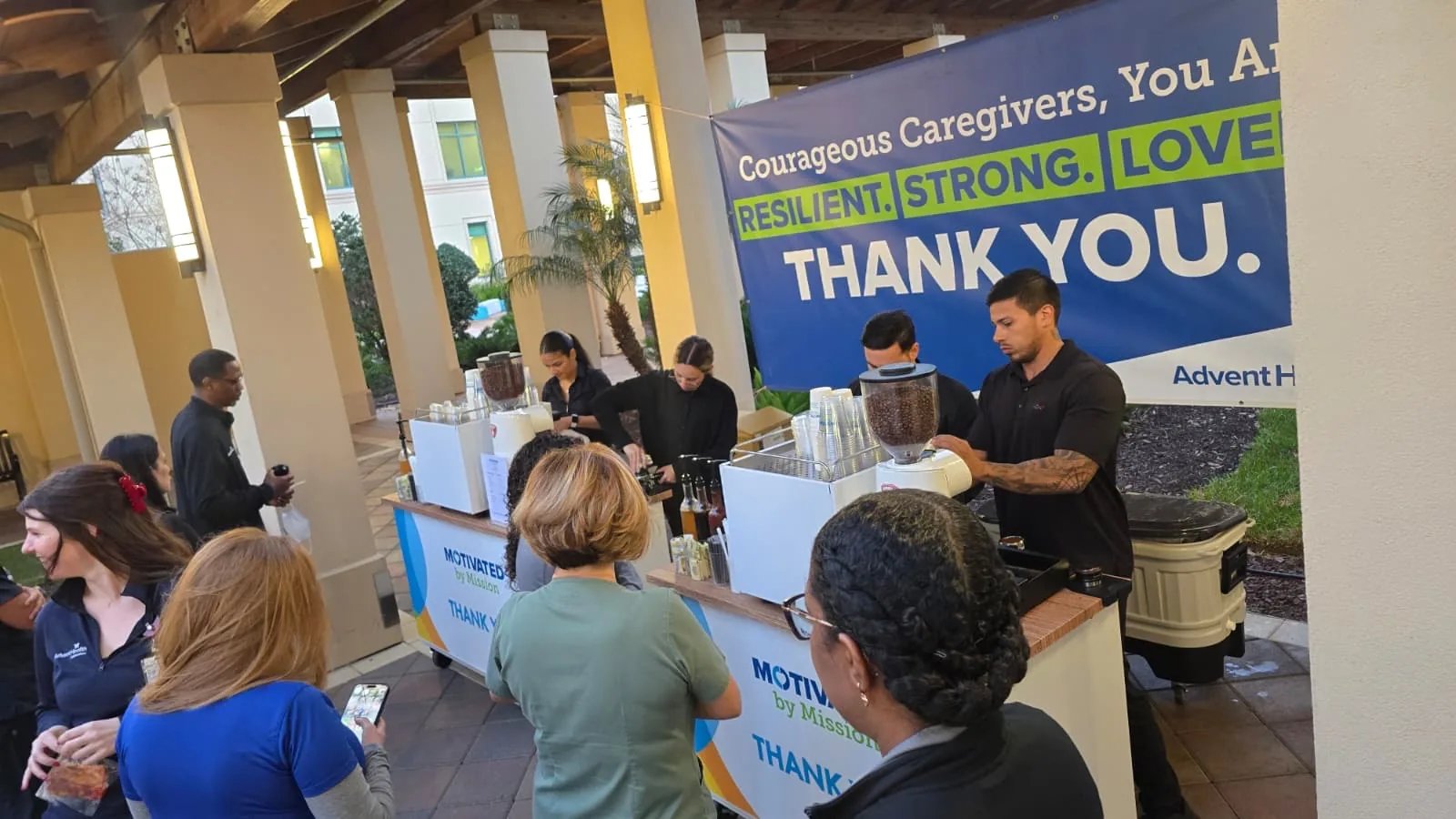 Take a Shot Coffee baristas serving back-to-back espresso drinks to AdventHealth caregivers