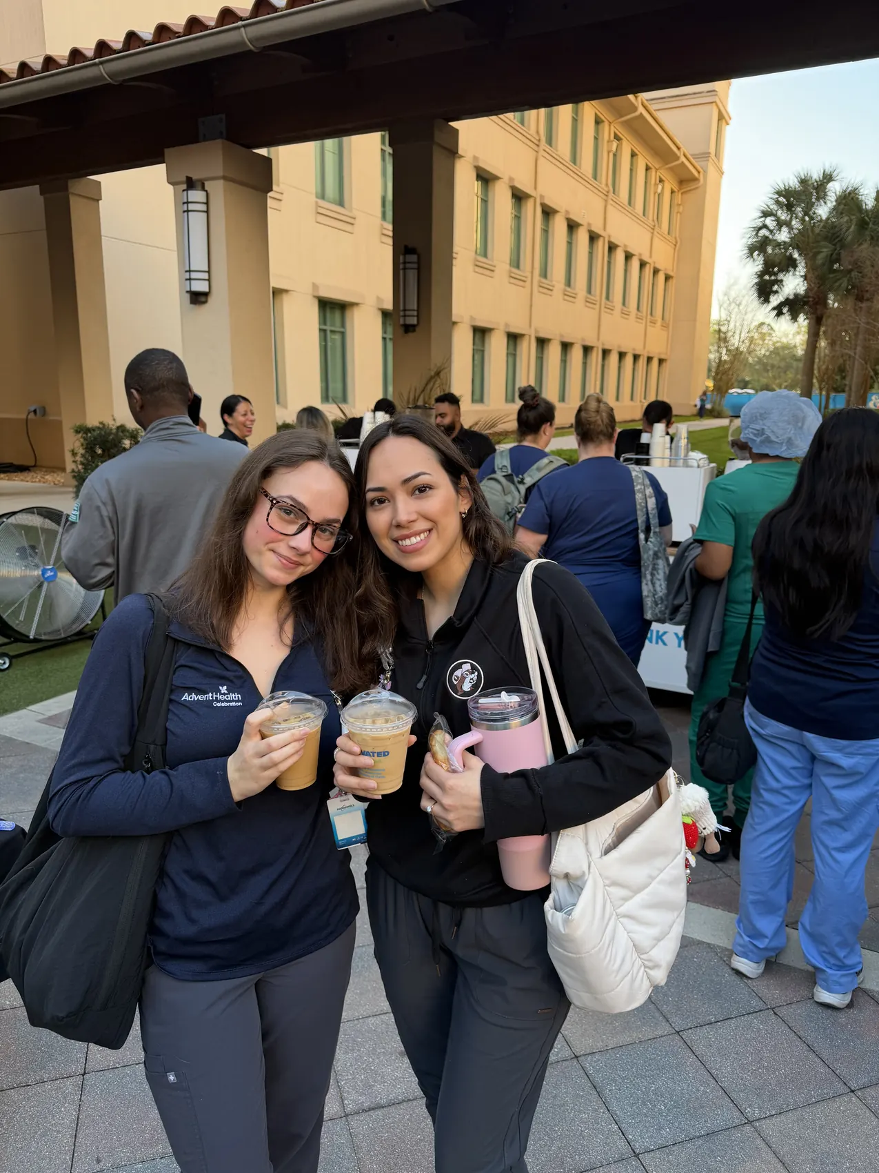 AdventHealth Celebration staff with branded iced coffees at the Motivated by Mission event in Orlando