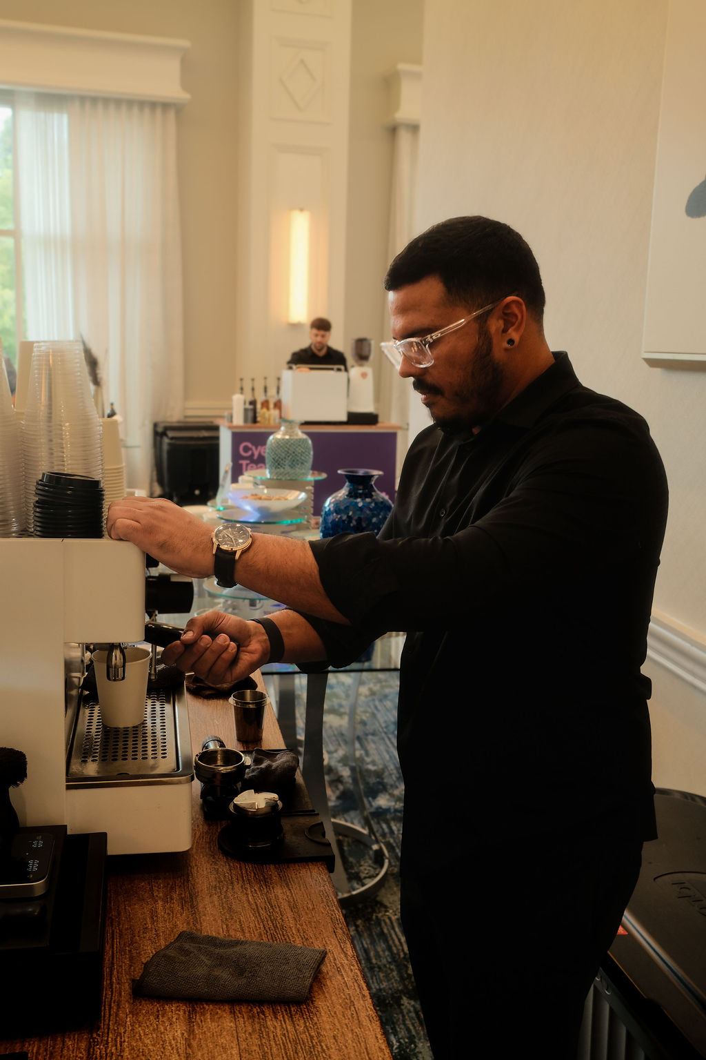 Barista pulling an espresso shot during Cyera's conference at the Waldorf Astoria Orlando