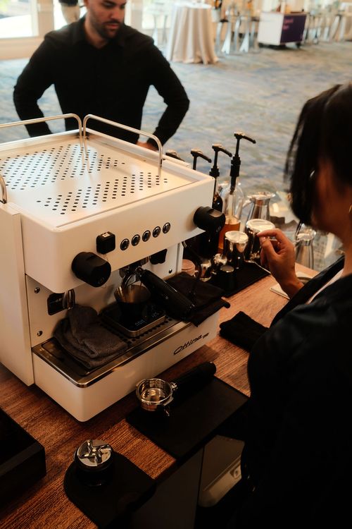 Espresso shot pulling on a scale at a Take a Shot Coffee cart during Cyera's conference in Orlando
