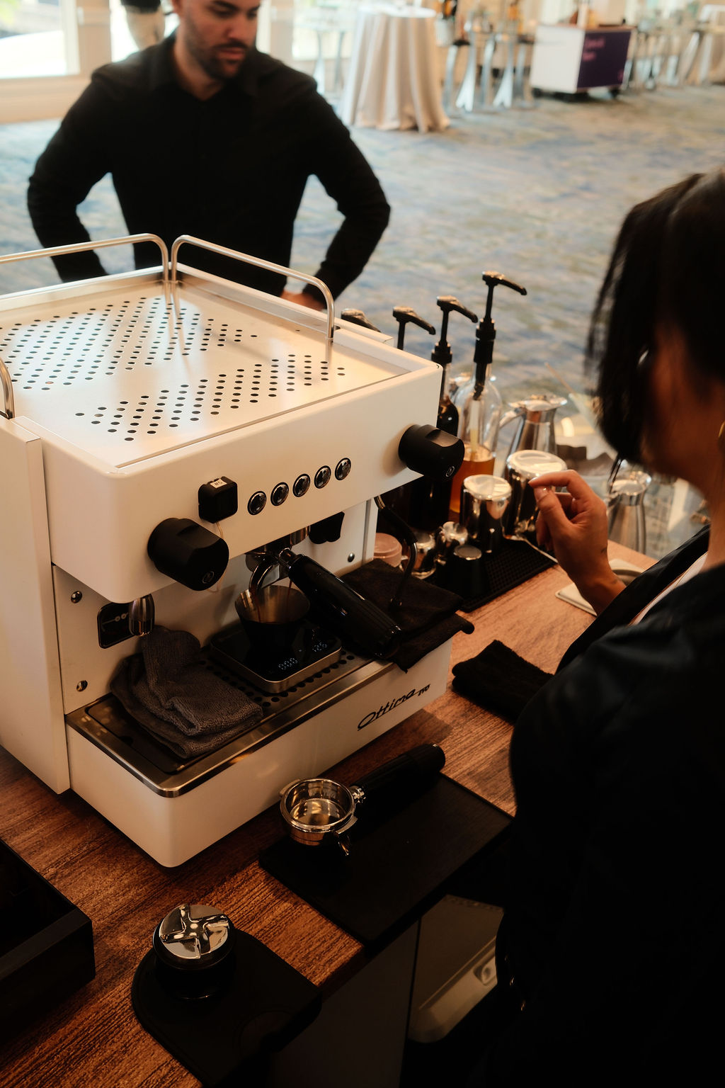 Espresso shot pulling on a scale at a Take a Shot Coffee cart during Cyera's conference in Orlando